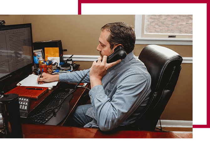 Photo Of C. Brent Keeton At His Office Desk